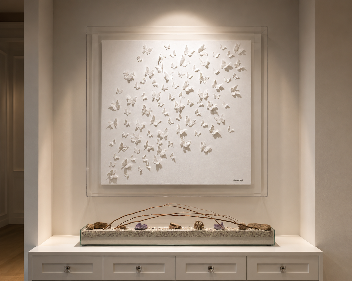 A sculptural white butterfly commission installed in a lit alcove